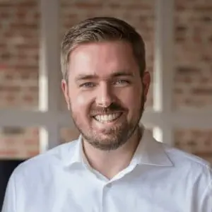 Sebastian standing in PR office