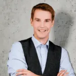 Man standing in front of concrete Wall